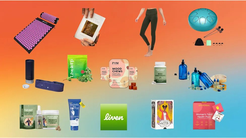 a selection of gifts for people in their healigng era including dog supplements, hand lotion, liven logo, a tarot card deck, universal u women's supplements, a steel tongue drum, leggings, an acupressure mat, super greens powder from live it up, a Regenix hair starter kit, spatial sleep headband wearable, mag threonate supplement, the fable book of runes from FABLERUNE, and PYM chews