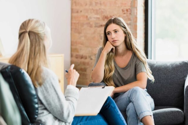 photo - Teenager Listening to Therapist